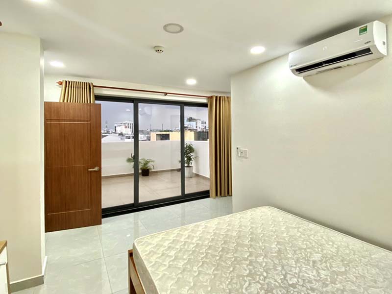 Bright rooftop serviced apartment for rent on Nguyen Van Dau Street Binh Thanh District.